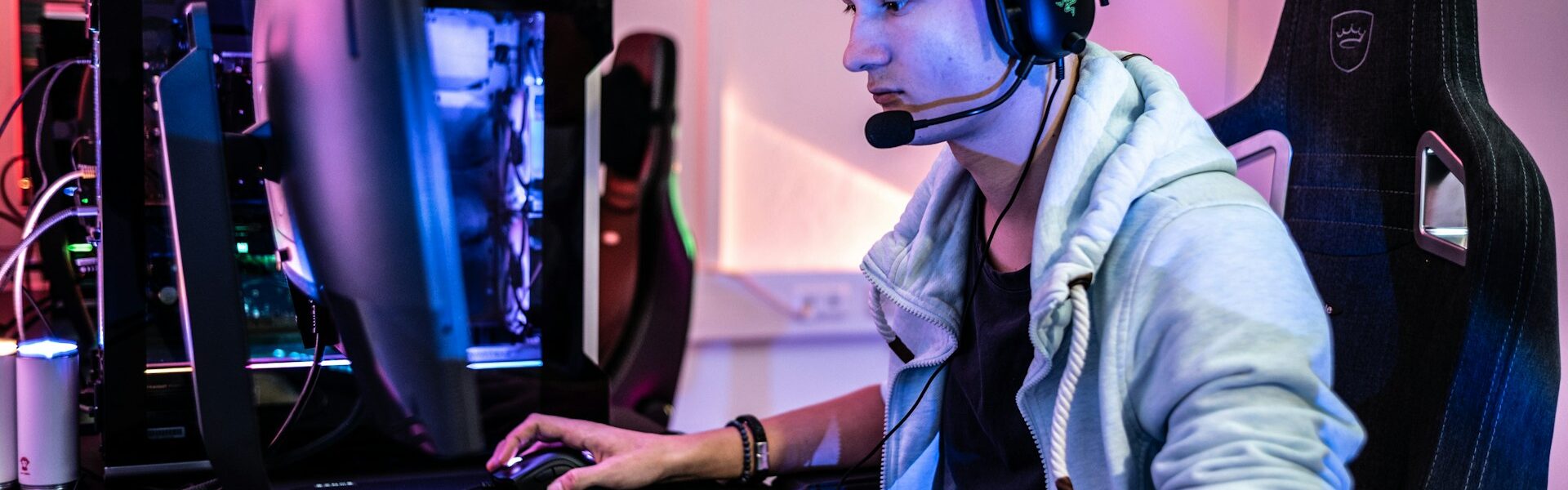 a person sitting in front of a computer playing video games like Kingdom Come: Deliverance 2 Image source: https://unsplash.com/photos/a-man-wearing-a-headset-and-using-a-computer-oPrXf-0Nf9Q