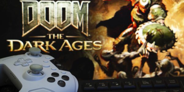 Doom: The Dark Ages on the TV with a white X Box controller in front of it