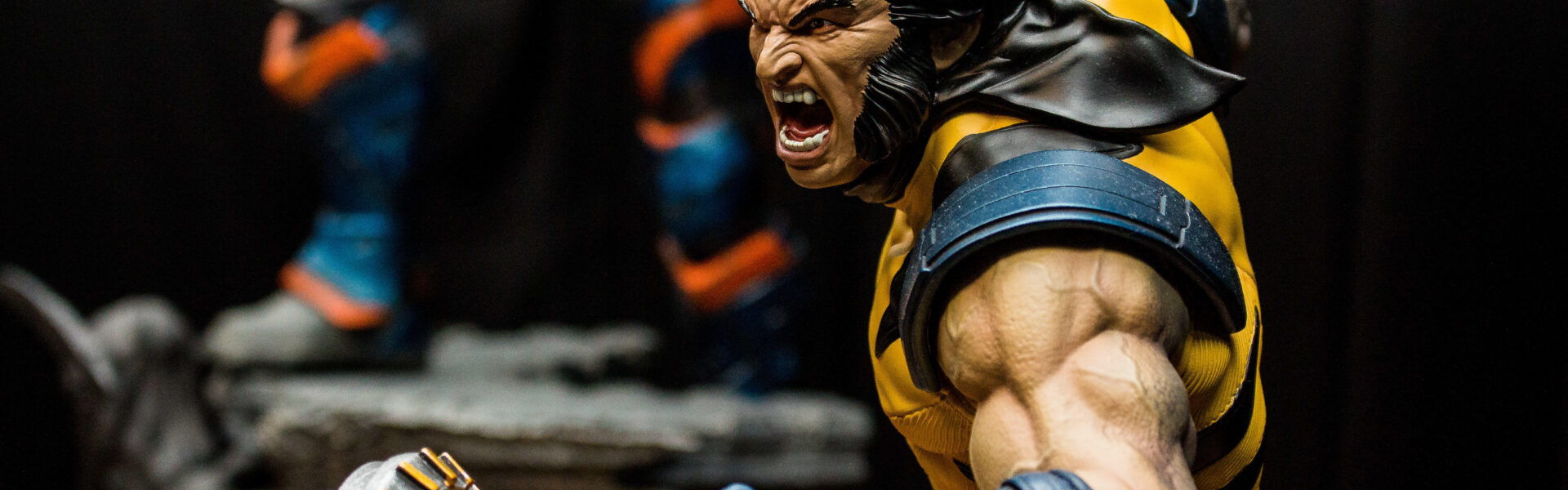 a Wolverine action figure in an aggressive pose in his famous yellow and black outfit