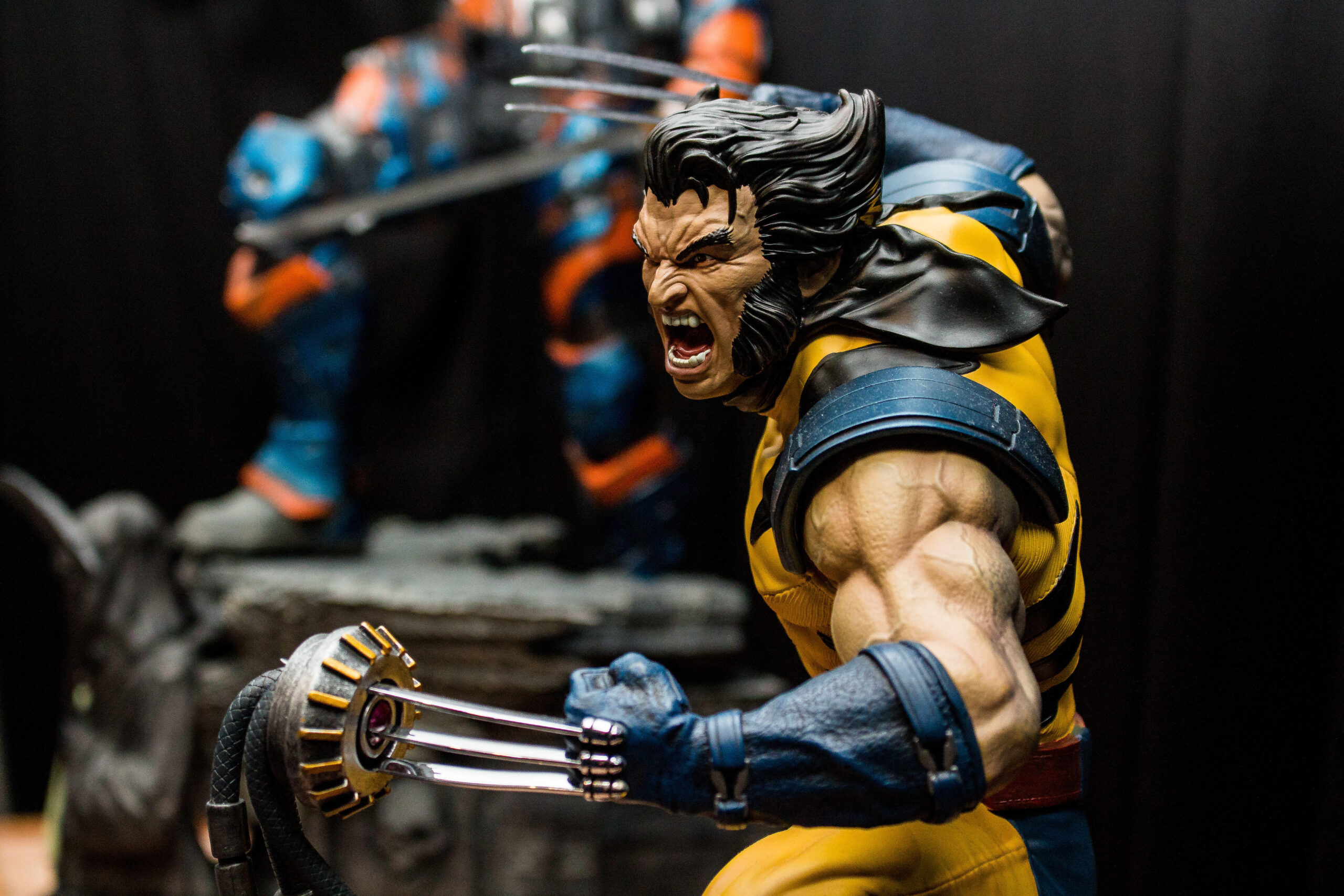 a Wolverine action figure in an aggressive pose in his famous yellow and black outfit