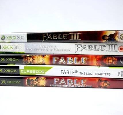 a stack of five different Fable games throughout the years to represent the hype for the newest release